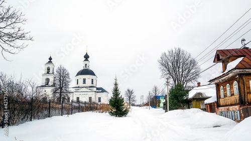 landscape with a rural orthodox church in winter