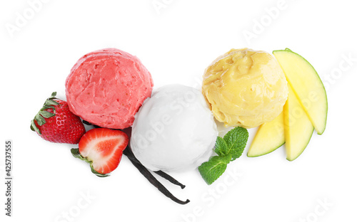 Scoops of different ice creams, fresh fruits and vanilla on white background, top view