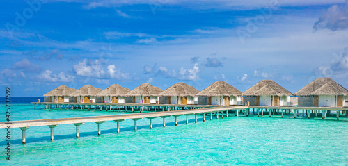 Travel landscape of Maldives beach. Tropical panorama  luxury water villa resort  wooden pier or jetty. Ocean lagoon  seaside. Luxury travel destination background for summer holiday vacation concept.