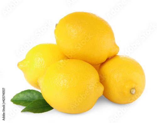 Fresh ripe lemons with green leaves isolated on white