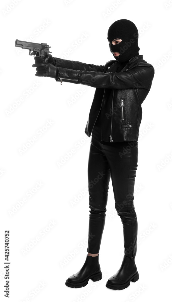 Woman wearing knitted balaclava with gun on white background Woman wearing knitted balaclava with gun on white background