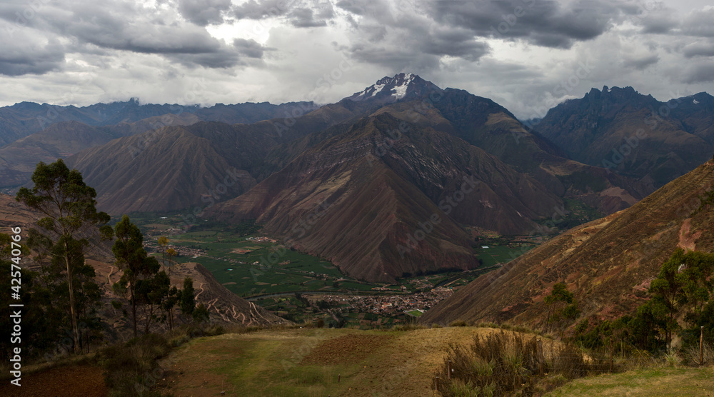 panoramic view of the mountains and huge valley below with different colours panoramic view of the mountains and huge valley below with different colours