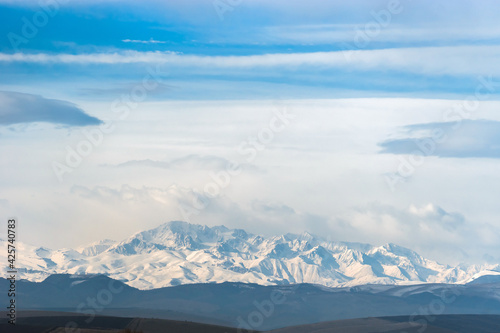 Snowy winter Caucasus mountains on the horizon. Kabardino-Balkaria  Russia.