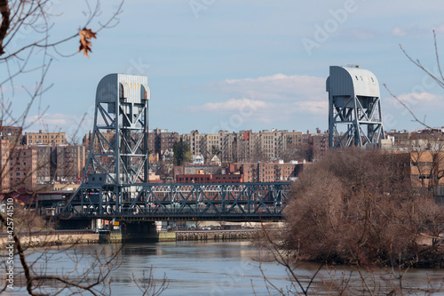 view of the Broadway Bridge, a double deck vertical lift bridge, connecting Inwwod in Northern Manhattan to Marble HIll and the Bronx from across the Harlem River Ship Canal photo
