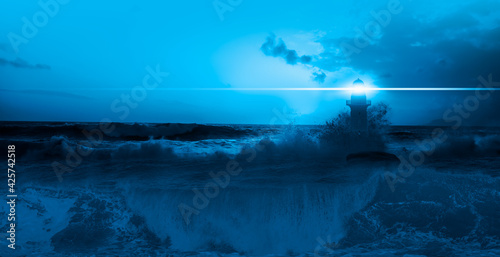 Lighthouse and giant waves in the middle of a stormy sea