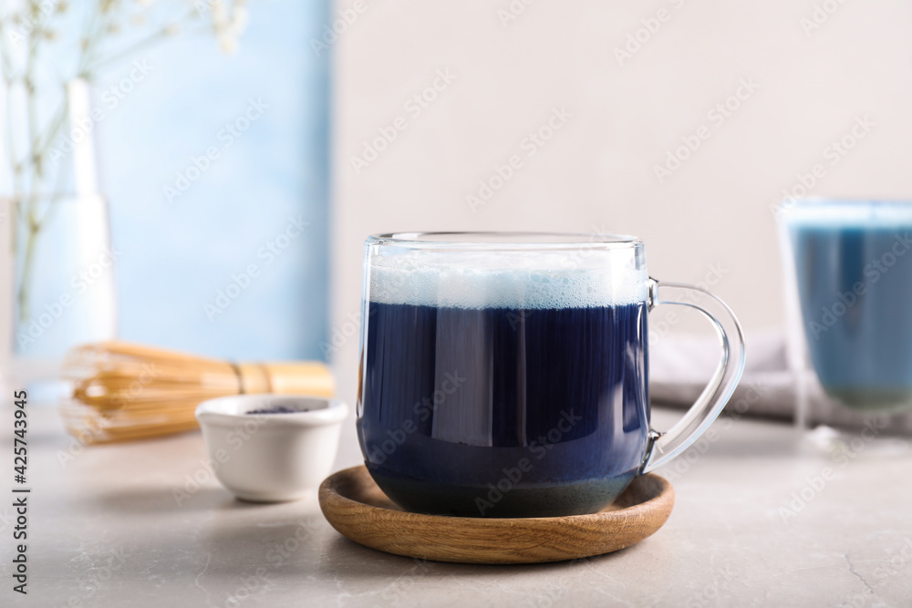 Delicious blue matcha drink on light grey table Delicious blue matcha drink on light grey table