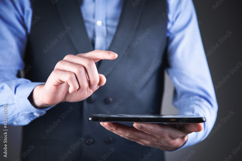 man holding digital tablet device in hands man holding digital tablet device in hands