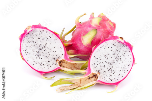One whole and two half dragon fruit pitaya, on a white background, isolated
