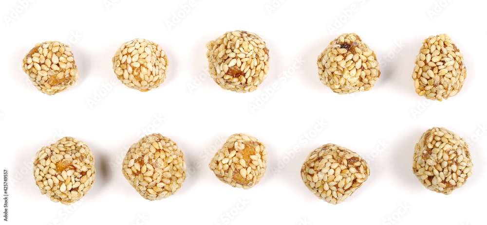 Caramelized hazelnut balls with sesame seeds, dessert set and collection isolated on white background, top view Caramelized hazelnut balls with sesame seeds, dessert set and collection isolated on white background, top view