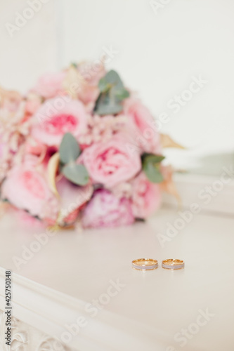 Wallpaper Mural Wedding rings on background of Tender Bride's bouquet with delicate tea roses Torontodigital.ca