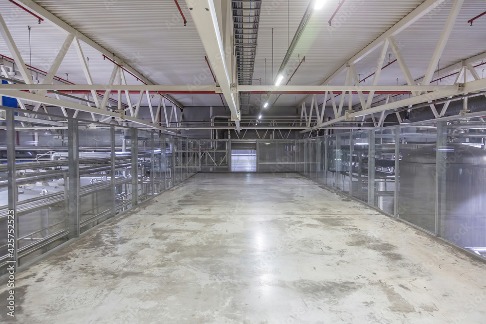 Inside the building of the Moscow Brewing Company plant. Long empty corridor in a modern industrial production area. Mytishchi, Russia Inside the building of the Moscow Brewing Company plant. Long empty corridor in a modern industrial production area. Mytishchi, Russia
