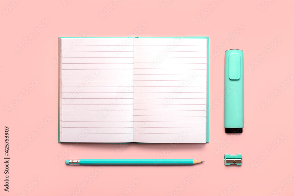 Open diary with copy space,blue pen,highlighter blue Marker and blue pencil sharpener.Workspace desk Open diary with copy space,blue pen,highlighter blue Marker and blue pencil sharpener.Workspace desk