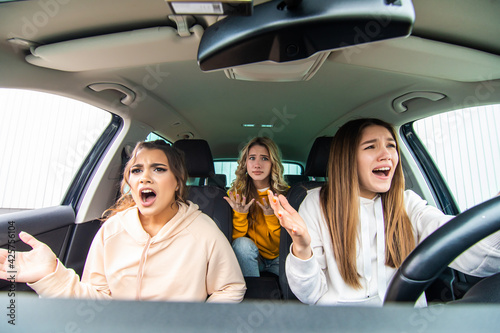 Three friends go on a trip. Young three women drive in a car shocked before car accident