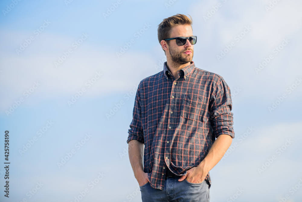 Fashionista. Handsome guy wear sunglasses. Hipster man in trendy sunglasses. Fashionable sunglasses. Ultraviolet protection concept. Man eyewear model outdoors blue sky background. Perfect vision Fashionista. Handsome guy wear sunglasses. Hipster man in trendy sunglasses. Fashionable sunglasses. Ultraviolet protection concept. Man eyewear model outdoors blue sky background. Perfect vision