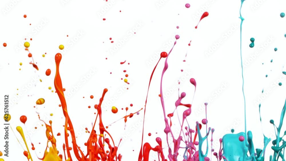 Colorful splashing paint in super slow motion.