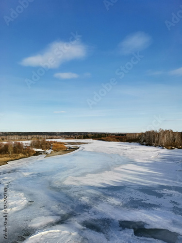 frozen river in march, landscape