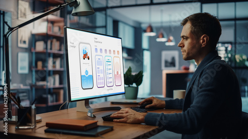 Handsome Caucasian Male Designer Working on Desktop Computer in Creative Living Room. Freelance Male is Developing New Food Delivery App Design, User interface in a Digital Graphics Editing Software.