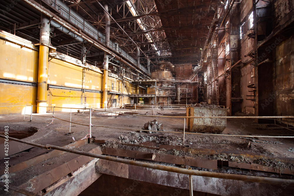 Stepnogorsk, Kazakhstan - April 04, 2012: Demolition of outdated Soviet sulfuric acid plant industrial building. Inside view. Stepnogorsk, Kazakhstan - April 04, 2012: Demolition of outdated Soviet sulfuric acid plant industrial building. Inside view.