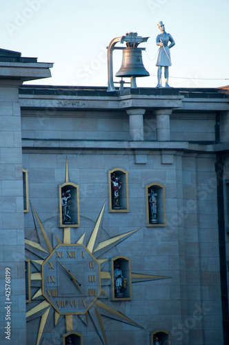 A large clock with figures, a bell and a human figurine on the roof. October 01, 2015, Brussels, Belgium. photo