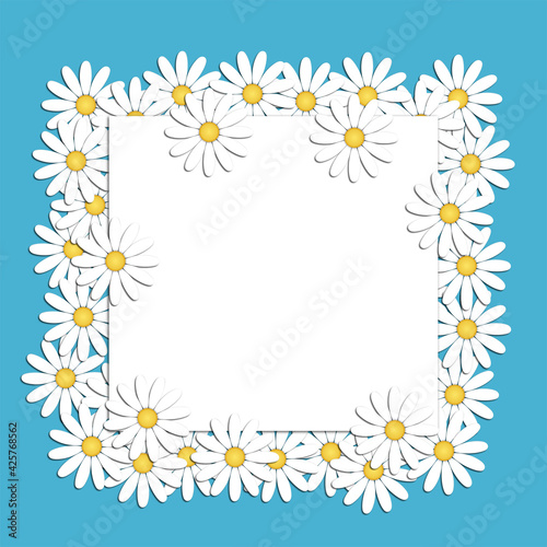 Beautiful modern background with white chamomile flowers with a blank sheet of writing paper in the center. Floral fashion creative ideas. Stylish nature spring or summer background. © Alina Lebed