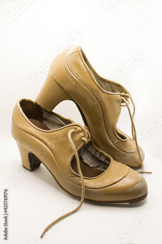 Old flamenco shoes on a white background