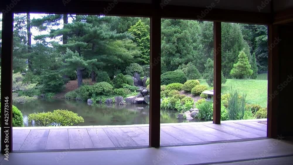 Pan from view of Japanese garden to interior of house with shoin desk. Pan from view of Japanese garden to interior of house with shoin desk.