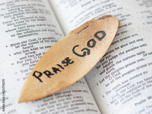Open Bible Psalms song with a message to praise God our Father and Lord Jesus Christ for His mercy grace righteousness. Trust faith love in God. Bible concept.