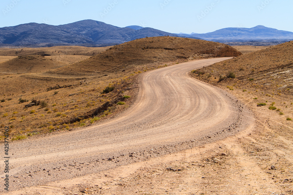 Gravel road through namib desert in Namibia