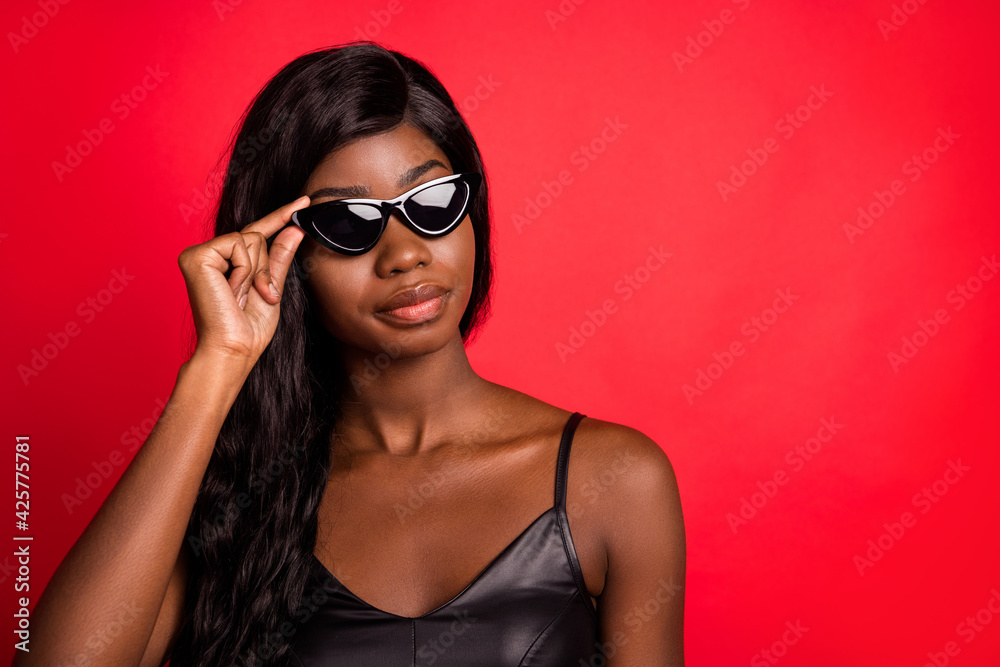 Portrait of attractive chic luxurious girl wearing touching specs copy space isolated over bright red burgundy color background