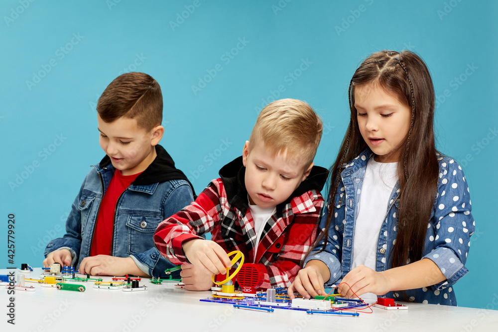children playing with electronic constructor at studio children playing with electronic constructor at studio