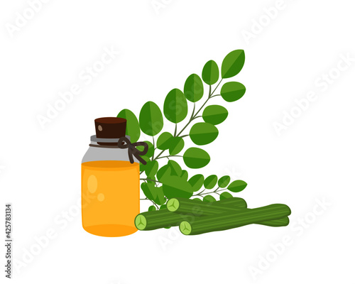bottle of moringa essential oil with green leaves