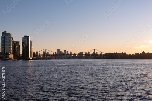 Sunset along the East River with the Williamsburg Bridge in New York City