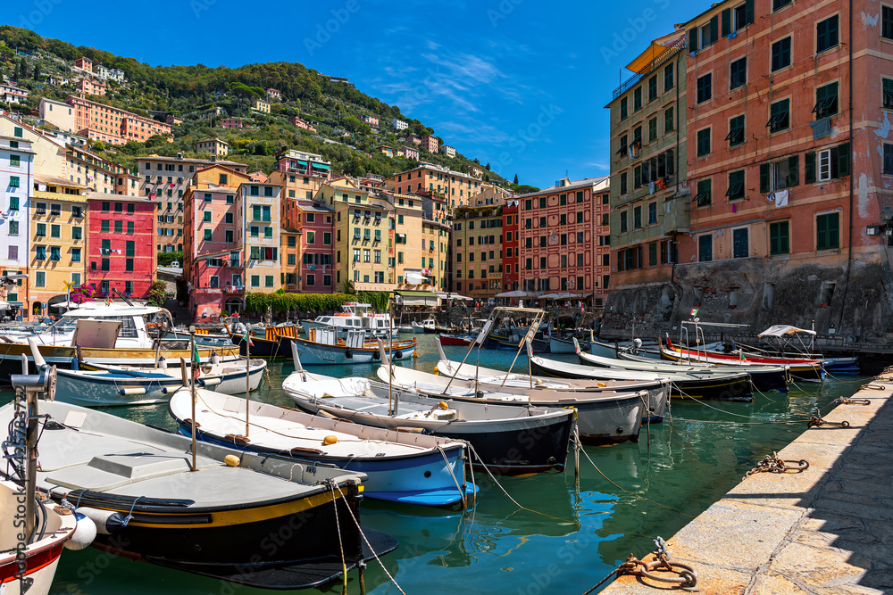 Boats and colorful houses of Camogli, Italy.