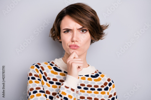 Quadro su tela Portrait of pretty minded skeptic brown-haired girl overthinking isolated over g
