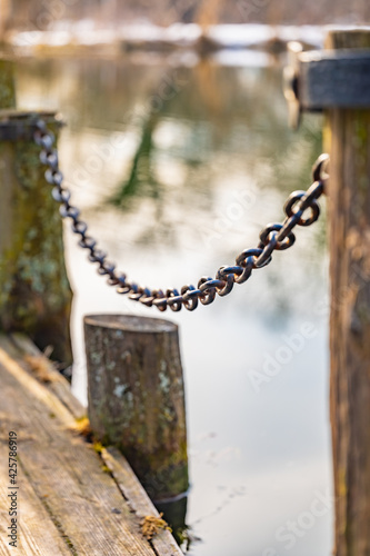 old wooden pier with chain