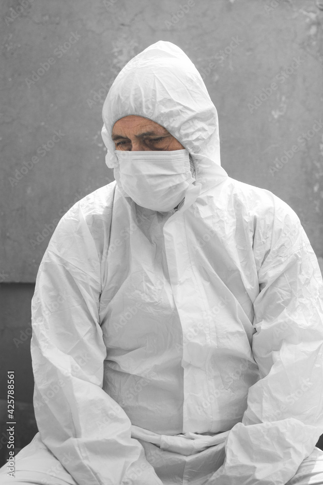 man with mask and white protective suit