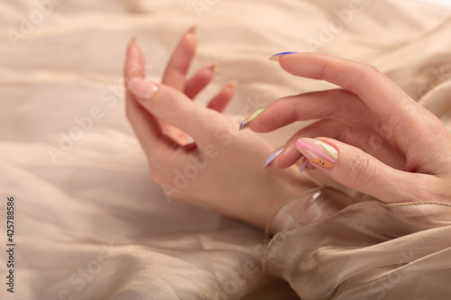 female hands and manicure. woman's nail, designed with nail art