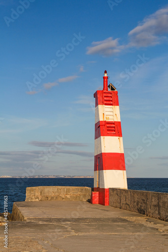 lighthouse on the breakwater in Lagos  Algarve  Portugal