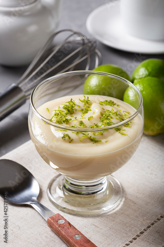 Lemon mousse with lemon zest on top.