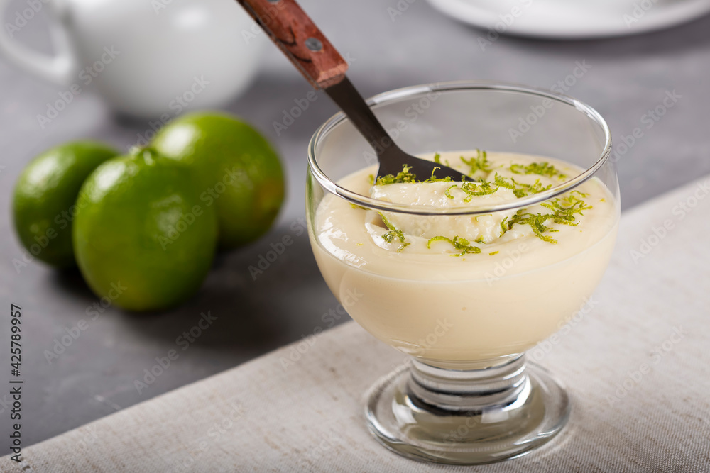 Lemon mousse with lemon zest on top.