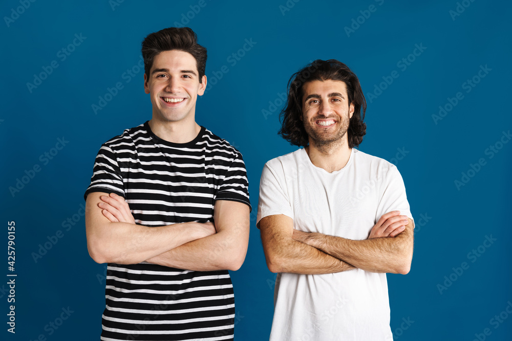 White brunette two men looking and smiling at camera White brunette two men looking and smiling at camera
