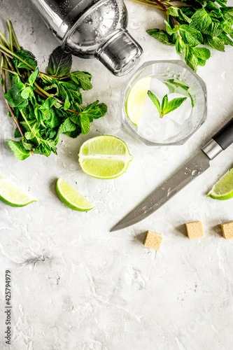 making mojito on stone background top view