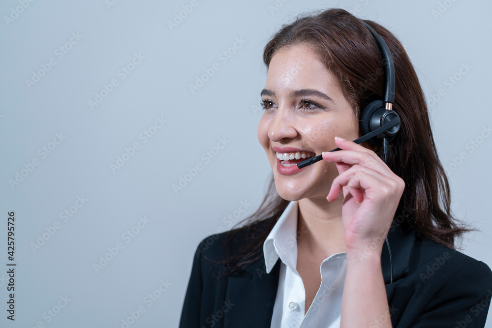 Beautiful female staff wearing headphones, smiling beauty, ready to help. Beautiful female staff wearing headphones, smiling beauty, ready to help.