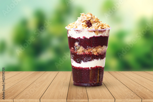 Cup of strawberry Açaí Wood boards unfocused background