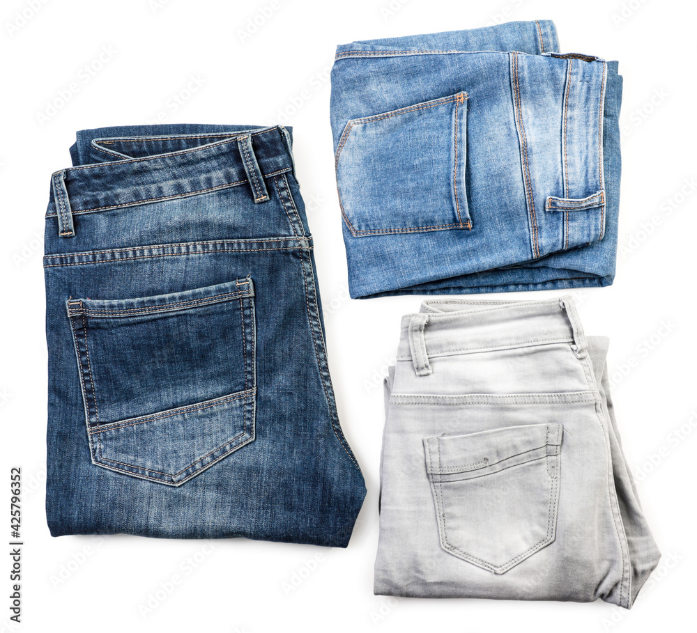 Set of folded jeans on white background, isolated. The view from top