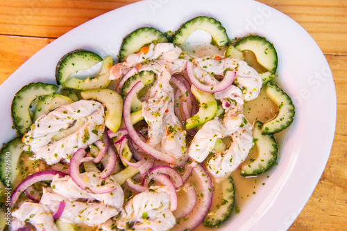 Obraz na płótnie Traditional Mexican seafood. Aguachile, Mexican seafood food with copy space. Mexican seafood on wooden table. Traditional Mexican food concept. w salonie