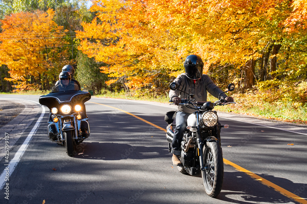 Group of friends riding motorcycles in the fall in Canada