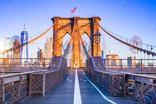 Brooklyn Bridge and Manhattan sunrise, New York City in USA.