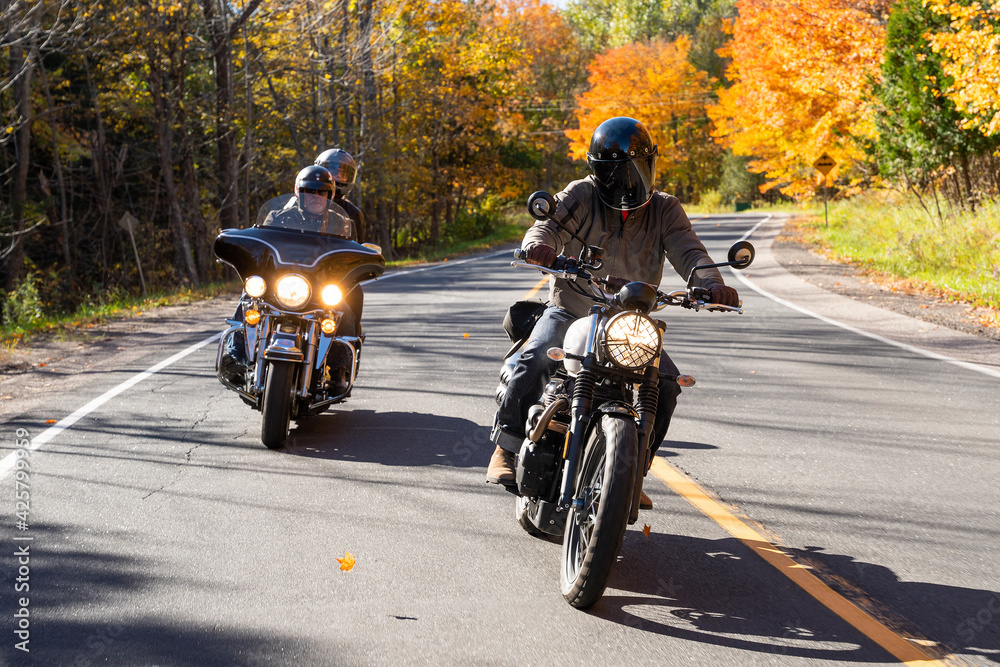 Group of friends riding motorcycles in the fall in Canada