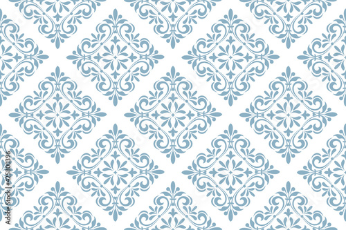 Wallpaper in the style of Baroque. Seamless vector background. White and blue floral ornament. Graphic pattern for fabric, wallpaper, packaging. Ornate Damask flower ornament